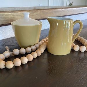 Vintage mid century modern ceramic creamer and sugar bowl.  Light mustard/creme.